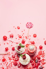 Wall Mural - Sweets. Candy And Cupcakes On Pink Background