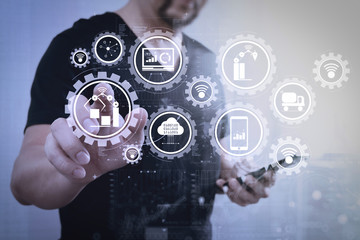 Aufkleber - Businessman hand pressing an imaginary button,holding smart phone,digital screen graphic virtual icons,graph,diagram