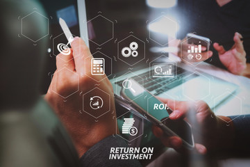 Poster - Photo website graphic designer hand working with his team make new project in studio.Modern laptop extend screen digital tablet smart phone on marble table. sun flare effect