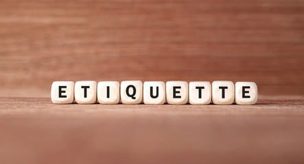Poster - Word ETIQUETTE made with wood building blocks