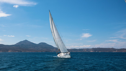 Sailing ship luxury yacht with white sails in the Mediterranean sea.