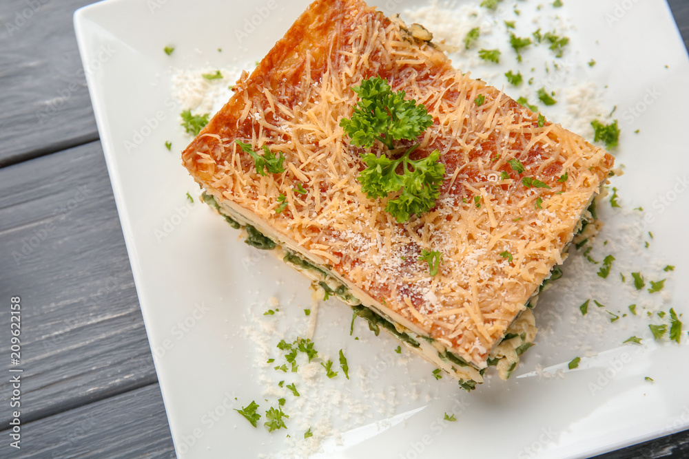 Lasagna with spinach on plate, close up