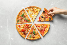 Woman Taking Slice Of Delicious Pizza On Light Background, Top View