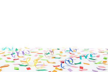 Wall Mural - Colorful confetti and streamers on white background