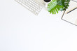 © Prathankarnpap - Workspace topview computer keyboard and coffee with notebook paper on white desk.