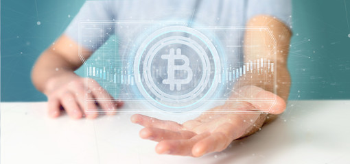 Poster - Man holding a technology Bitcoin icon on a circle 3d rendering