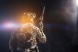© fotofabrika - Special forces soldier with rifle on dark background