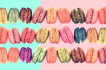 Wall Mural - Colorful rows macarons on vintage pastel  background