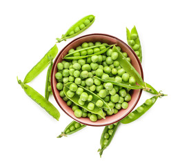 Bowl with green peas on white background