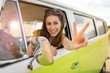© pikselstock - Young woman enjoying a roadtrip