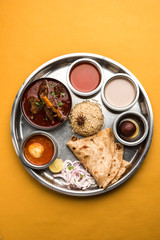 Wall Mural - Motton Thali OR Gosht/Lamb platter is Indian/asian non veg lunch/dinner menu consists of meat, egg curry with chapati ,rice, salad and sweet Gulab Jamun