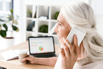 Wall Mural - Close up of smiling mature business woman