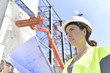 © goodluz - Construction manager woman controlling industrial site