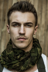 Wall Mural - Close-up portrait of young male military soldier 