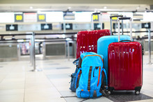 Stack Of Travelers Luggage In Airport Terminal
