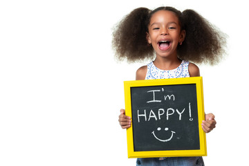 Wall Mural - Cute african american girl laughing and holding a sign with a happy phrase