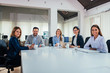 © bnenin - Business people in conference room.