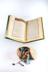 Wall Mural -  Holy Quran and prayer beads on stand.