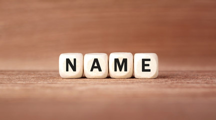 Poster - Word NAME made with wood building blocks