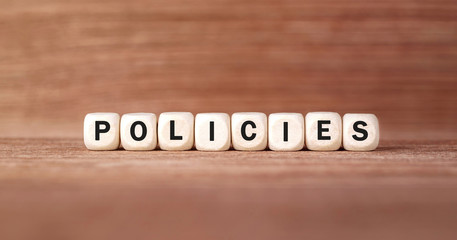 Poster - Word POLICIES made with wood building blocks