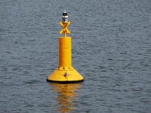 Yellow Buoy Floating In The Sea