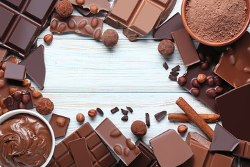 Poster - Chocolate pieces with nuts and cocoa balls on wooden table