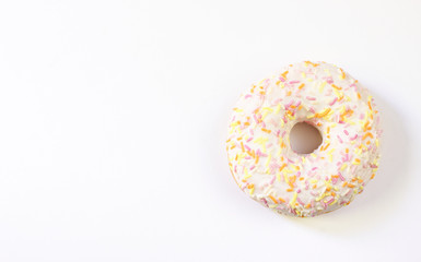 Donut with white icing colored topping