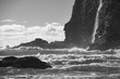 A black and white photograph of waves smashing against Cape Meares, Oregon