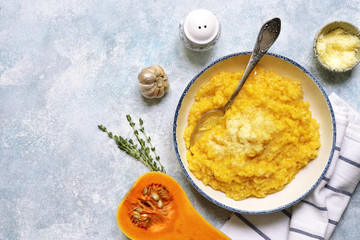 Wall Mural - Delicious pumpkin risotto with garlic and thyme.Top view with copy space.