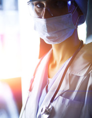 Image of attractive woman doctor looking at x-ray results.