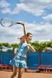 Sportive girl plays tennis