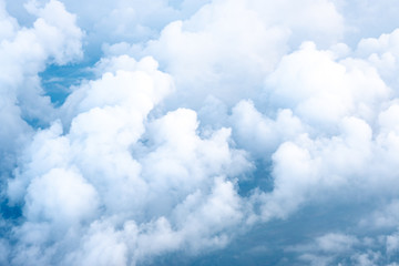 Wall Mural - big blue sky and cloud top view from airplane window,nature background.