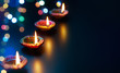 © phive2015 - Colorful Diya lamps with bokeh lights background