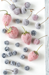 Wall Mural - Assortment of frozen berries on the white plate