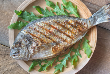 Poster - Grilled gilt-head bream with fresh arugula