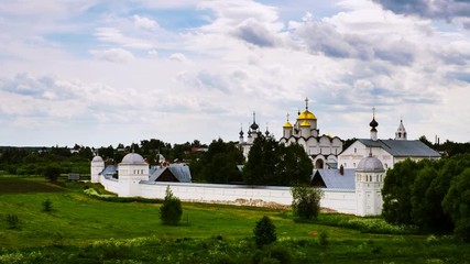 Sticker - Suzdal, Russia. Panoramic view of Intercession (Pokrovsky) Monastery in Suzdal, Russia during a cloudy day. Golden tour trip in Russia. Time-lapse with fast moving clouds