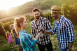 © NDABCREATIVITY - People tasting wine in vineyard