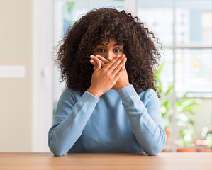 Sticker - African american woman at home shocked covering mouth with hands for mistake. Secret concept.