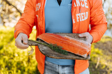 Crop Man With Salmon Fillet Outside