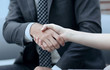 © ASDF - close-up handshake of business partners.