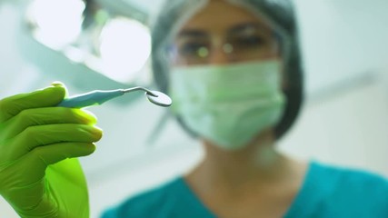 Wall Mural - Dentist examining patient teeth, treatment of toothache, professional services