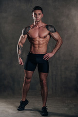 Studio Shot of a Stunning Hot Sporty Body of a Fitness Man with Perfect Forms