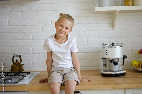 Portrait Of Cute Positive 7 Year Old Little Boy With Gathered