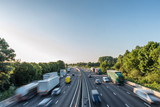 Sunset view heavy traffic moving at speed on UK motorway in England
