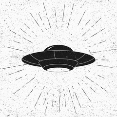 UFO and divergent rays on blackboard. UFO Flying Saucer Icon isolated on white background.