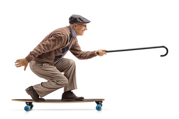 Canvas Print - Elderly man riding a longboard and holding a cane