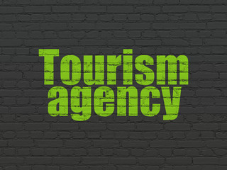 Canvas Print - Travel concept: Painted green text Tourism Agency on Black Brick wall background