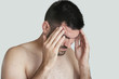 © triocean - Young man with headache, portrait of worried young man