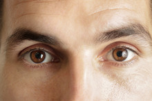 Close Up View Of A Brown Man Eyes Looking At Camera