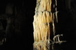 © porpendero - underground view of stalactites and stalagmites in natural halls in Postojna cave, Slovenia, Europe